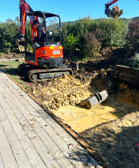 Excavator preparing the pool site